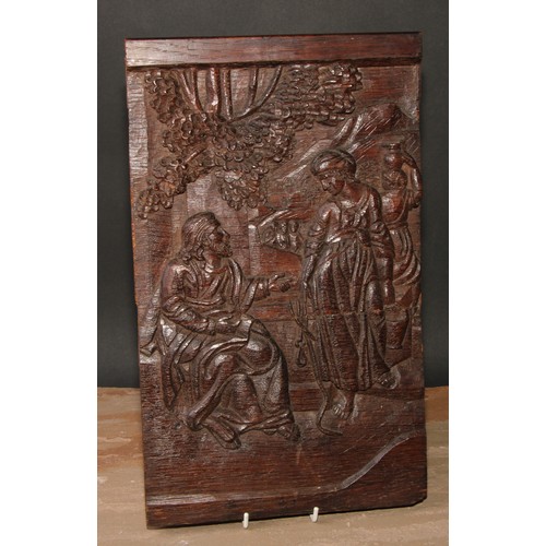 298 - A North European oak rectangular panel, carved in relief with The Samaritan Woman at the Well, 39.5c... 