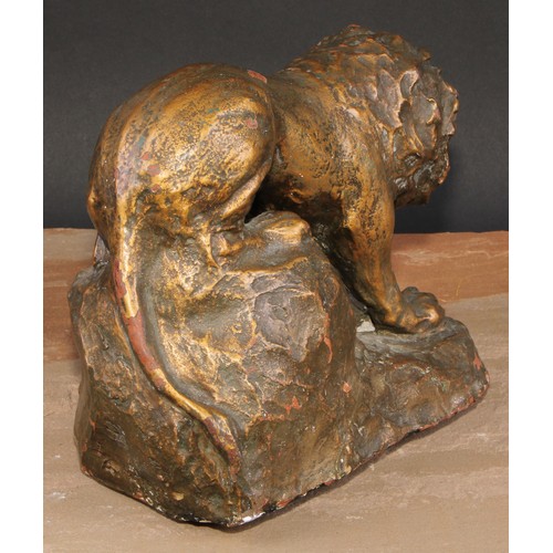 621 - Modern British School, a gilt patinated terracotta maquette, of a lion, 25cm long