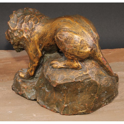 621 - Modern British School, a gilt patinated terracotta maquette, of a lion, 25cm long