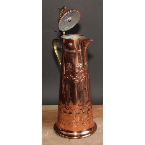 404 - A WMF Secessionist copper and brass spreading cylindrical flagon, embossed with stylised organic for... 