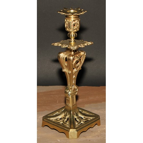 328 - A pair of French gilt metal table candlesticks, cast throughout with scrolls and acanthus, canted sq... 