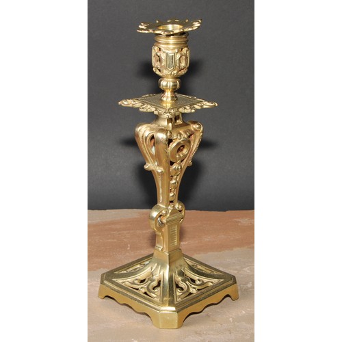 328 - A pair of French gilt metal table candlesticks, cast throughout with scrolls and acanthus, canted sq... 