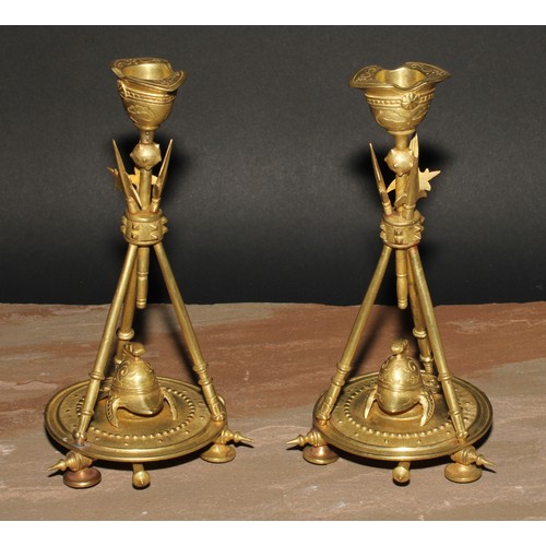 327 - A pair of French gilt bronze candlesticks, cast in the Neo-Classical taste with triumphal regalia, 2... 