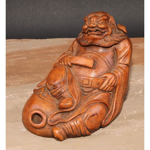 138 - A Chinese bamboo figure, carved as an elder seated on a gourd, 14.5cm high