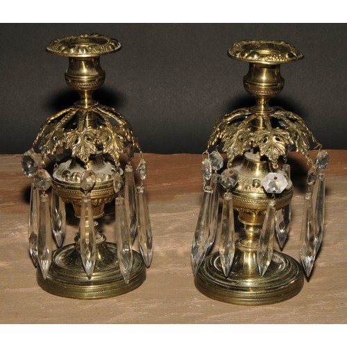 345 - A pair of post Regency candle lustres, each campana sconce above a band of vine leaves, faceted drop... 