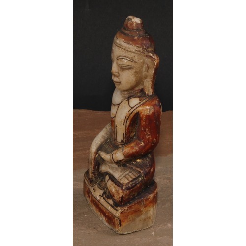 136 - A Chinese alabaster Buddha, seated, calling the Earth to witness, traces of painted and gilt decorat... 