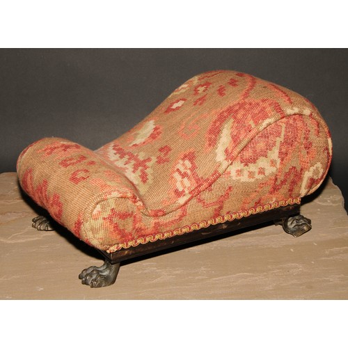 361 - A Regency gout stool, stuffed-over upholstery, gilt brass lion paw feet, 41cm long, c.1820