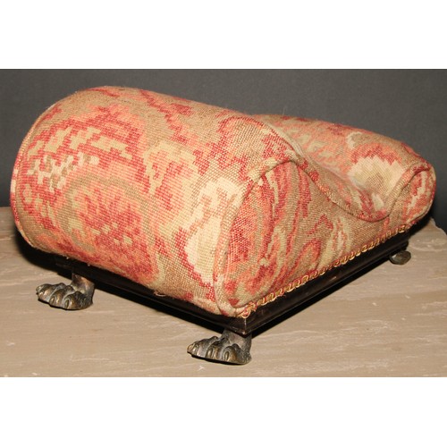 361 - A Regency gout stool, stuffed-over upholstery, gilt brass lion paw feet, 41cm long, c.1820