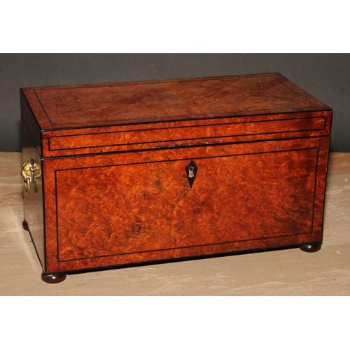 359 - A Regency amboyna rectangular tea caddy, hinged cover enclosing a pair of canisters and a glass bowl... 