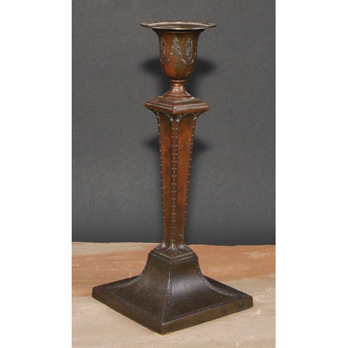 419 - An Adam Revival bronze candlestick, in the Neo-Classical taste with batwing paterae and bell husk sw... 