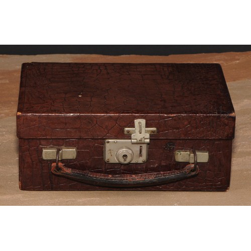 281 - A mid-20th century crocodile leather travelling jewellery box, hinged cover enclosing a fitted tray,... 