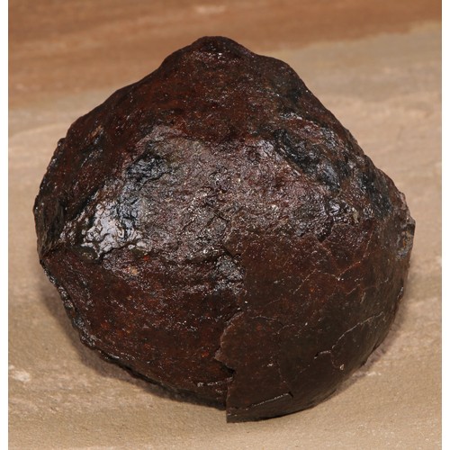 485 - An excavated iron canon ball, 9cm diam