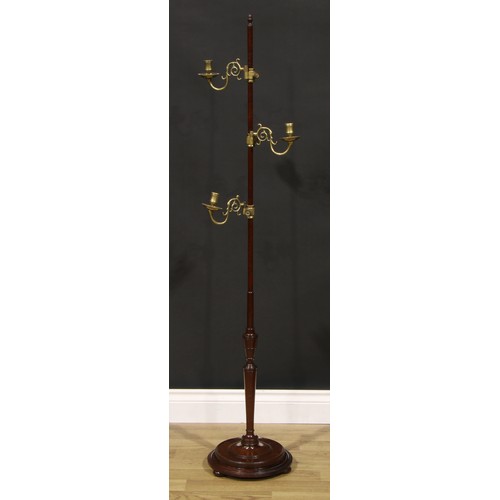 503 - An unusual 19th century mahogany and brass adjustable floor standing candle stand, acorn finial, thr... 