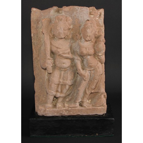 867 - Antiquities - an Indian pink sandstone stele, carved in bold relief with deities, 32cm high, c.11th/... 