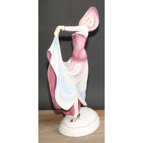 256 - A large Katzhutte Art Deco figure, of a lady dressed a la mode, oval base, printed mark, 50cm high