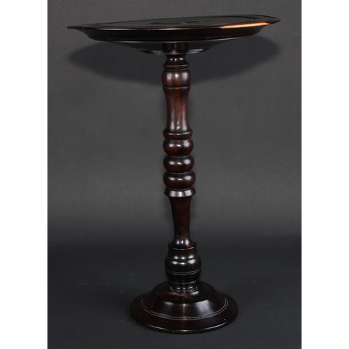 681 - Treen - an unusual 19th century lignum vitae wine table or candle stand, draught-turned, 43cm high, ... 