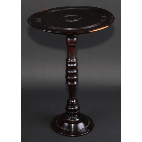 681 - Treen - an unusual 19th century lignum vitae wine table or candle stand, draught-turned, 43cm high, ... 