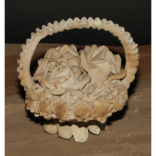 664 - The Wunderkammer - Natural Phenomena - a 19th century petrified curiosity, a basket of flowers, 14.5... 