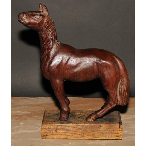 239 - A hardwood carving, of a horse, in the manner of an artist’s lay model, oak base, 33cm high overall