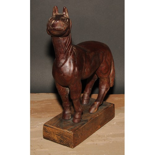 239 - A hardwood carving, of a horse, in the manner of an artist’s lay model, oak base, 33cm high overall