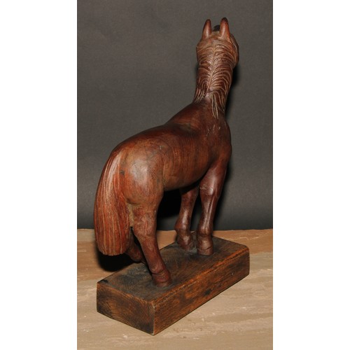 239 - A hardwood carving, of a horse, in the manner of an artist’s lay model, oak base, 33cm high overall