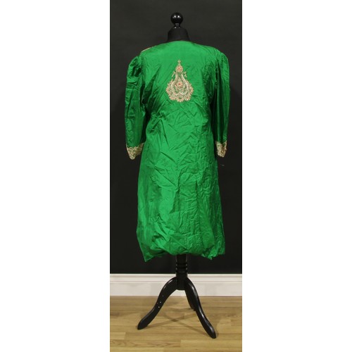 490 - An Indian emerald silk robe, worked in gilt and ruby thread with stylied lotus and 'peacock' motifs,... 