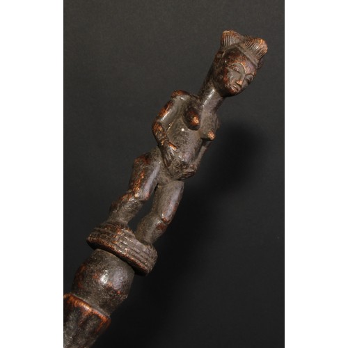 850 - Tribal Art - an African staff or house marker, carved with a female figure, 48cm high