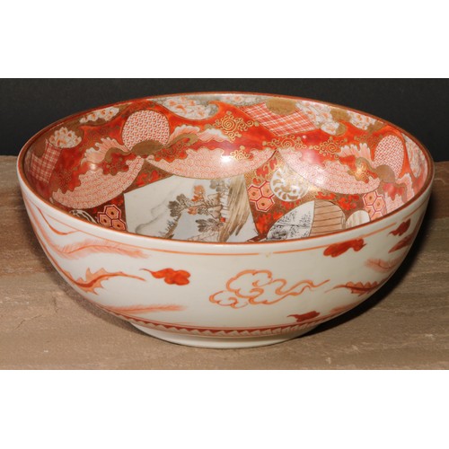 233 - A graduated pair of Japanese kutani bowls, decorated with figures and landscapes within assymetrical... 