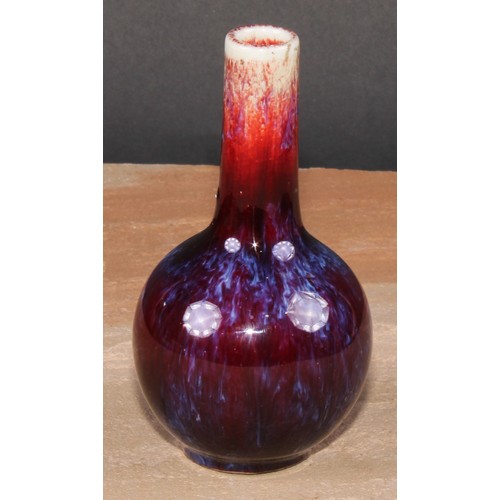 160 - A Chinese monochrome ovoid vase, glazed in mottled tones of peach and purple, 13cm high, seal mark