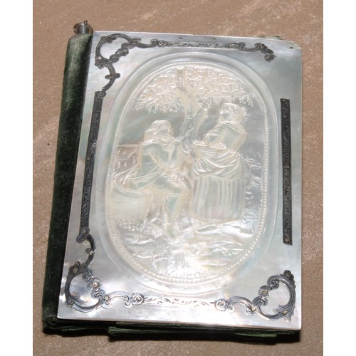 99 - A 19th century silver coloured metal mounted mother of pearl aide memoir, the front carved with a mu... 