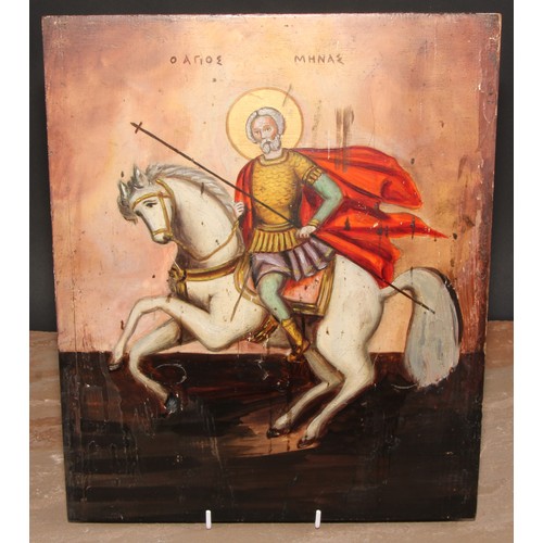 476 - An Eastern Orthodox icon, painted in polychrome with St Menas of Egypt, 36cm x 29.5cm