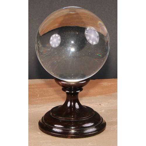 630 - Mysticism and the Occult - a large crystal ball, turned stand, 23cm high overall