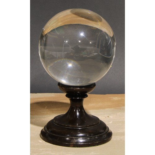 630 - Mysticism and the Occult - a large crystal ball, turned stand, 23cm high overall