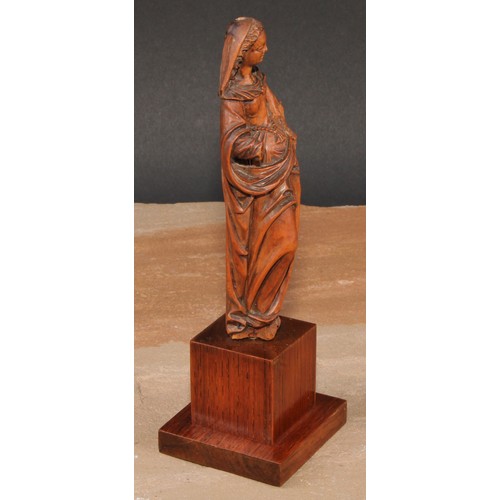 414 - An 18th century boxwood figure, carved as the Madonna, 15cm high, later oak plinth, 20cm high overal... 