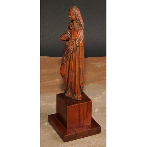 414 - An 18th century boxwood figure, carved as the Madonna, 15cm high, later oak plinth, 20cm high overal... 