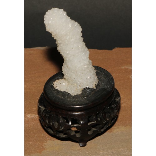 769 - Geology - a stalagtite specimen, mounted for the scholar's table, Chinese hardwood base, 9.5cm high ... 