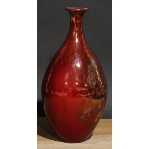 437 - An Art Pottery ovoid vase, decorated in silver lustre with a clown on a red ground, 24cm high