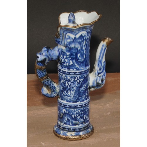 148 - A Chinese ewer and cover, decorated in tones of underglaze blue with dragons, metal fittings, 21cm h... 