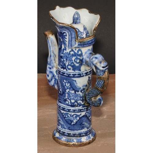 148 - A Chinese ewer and cover, decorated in tones of underglaze blue with dragons, metal fittings, 21cm h... 