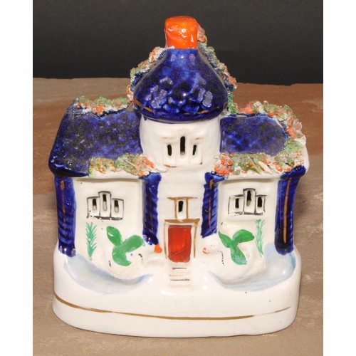 101 - A 19th century Staffordshire pottery novelty money box or bank, modelled as a cottage, 19cm high, c.... 