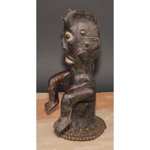 855 - Tribal Art - an Ekoi leather figural headdress, probably depicting an ancestor, fibre trim to base, ... 