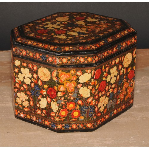 243 - A Kashmiri canted rectangular box and cover, decorated overall in polychrome with a dense arrangemen... 