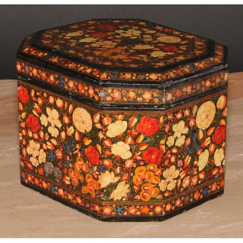 243 - A Kashmiri canted rectangular box and cover, decorated overall in polychrome with a dense arrangemen... 