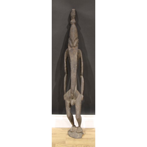 837 - Tribal Art - a Papua New Guinea figure, highly stylized, 103cm high, Sepik River