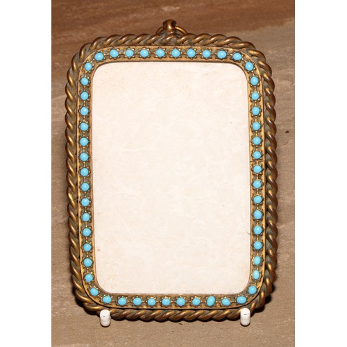 49 - A 19th century gilt brass rounded rectangular pendant picture or photograph frame, the rope-twist bo... 