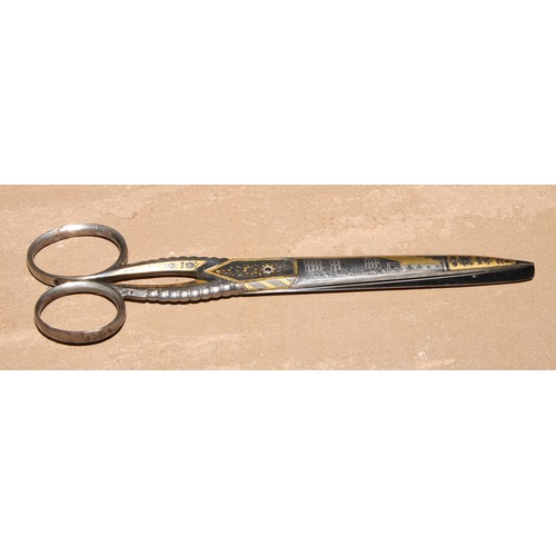 308 - A pair of 19th century Continental gilt damascened steel scissors, decorated with architectural view... 