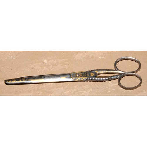 308 - A pair of 19th century Continental gilt damascened steel scissors, decorated with architectural view... 