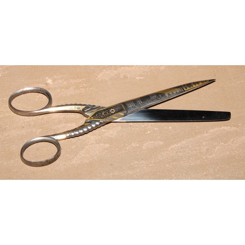 308 - A pair of 19th century Continental gilt damascened steel scissors, decorated with architectural view... 