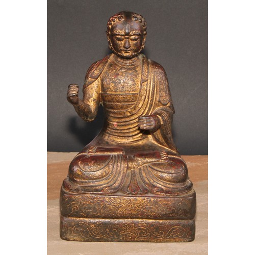 524 - Chinese School, a bronze Buuddha, seated in meditation, traces of gilding, 24cm high