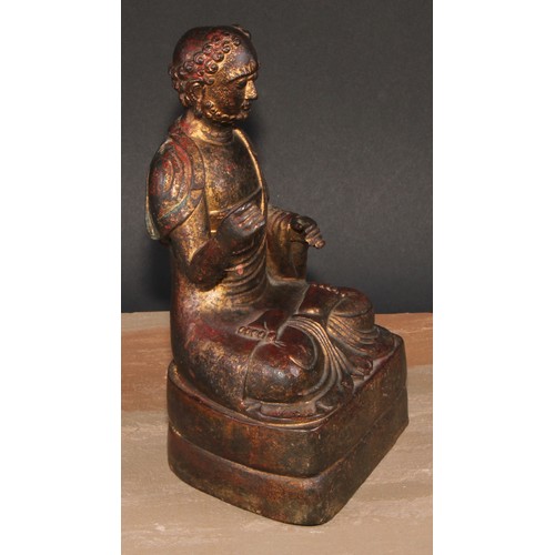 524 - Chinese School, a bronze Buuddha, seated in meditation, traces of gilding, 24cm high